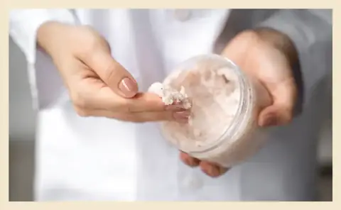 Woman using Dead Sea salt for skin care